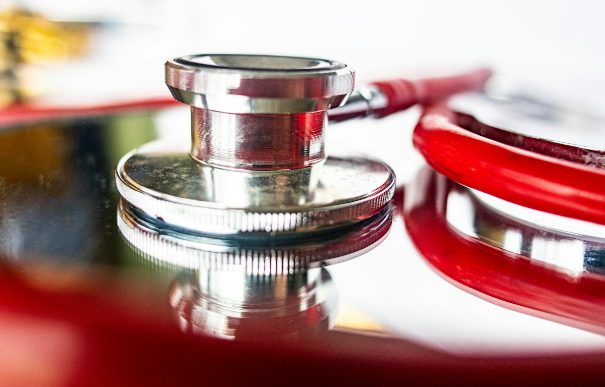 Close-up of a red stethoscope on a table