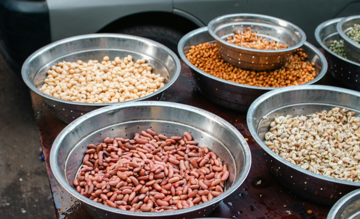 Bowls of dried beans and lentils at a Mumbai market